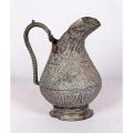 Antique Persian silvered copper jug densely decorated with foliage