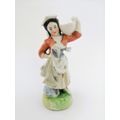 Continental figurine of a country maiden