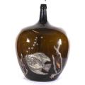 Large antique brown glass demijohn with applied pewter fish decoration, 50cm high