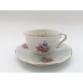 Pretty Demitasse cup and saucer White with flower design and gold trim