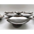 Eight mid century Danish stainless steel butter dishes