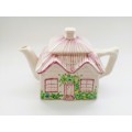Five cottage porcelain wares, comprising: teapot, milk jug, sugar bowl. butter dish and biscuit jar