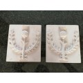 Pair of plaster-of-paris Thistle plaques