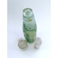 Three antique glass bottles