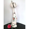 Tall ceramic white cat statue with flowers