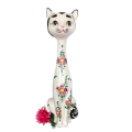 Tall ceramic white cat statue with flowers