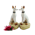 Pair of porcelain tall greyhound statues