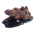 Antique Chinese wood carving depicting an Ox or Water Buffalo with two passengers