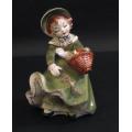 Girl in Green with Flower Basket Figurine.
