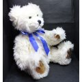 White Teddy Bear with Blue Ribbon