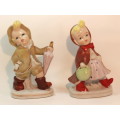 Charming Little Boy and Girl in Hooded Jackets Porcelain Figurines.