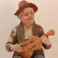 Vintage Porcelain Figurine of Old Man with Guitar