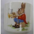 VINTAGE 1936 Royal Doulton Bunnykins egg cup. "Bunny playing a trumpet & bunny riding a toy horse