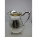 LARGE SILVER PLATED VINTAGE  JUG WITH ICE LIP LOVELY CHASED DECORATION. EXCELLENT CONDITION 20CM
