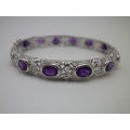 Sterling Silver rolled in 18ct white gold hinge bangle set with 12 oval cut natural Amethysts