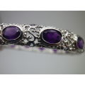 Sterling Silver rolled in 18ct white gold hinge bangle set with 12 oval cut natural Amethysts