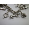 Sterling Silver Vintage Charm bracelet. Hallmarked clasp. Heavy Rare charm. 72grms Excellent quality