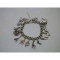 Sterling Silver Vintage Charm bracelet. Hallmarked clasp. Heavy Rare charm. 72grms Excellent quality