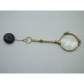Vintage Gold Plated spring loaded lorgnette with brooch attachment. Made in Germany