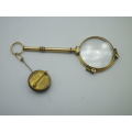 Vintage Gold Plated spring loaded lorgnette with brooch attachment. Made in Germany