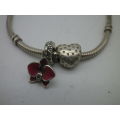 PANDORA silver bracelet with cubic zirconia studded heart and enamel orchid charms. 20cm