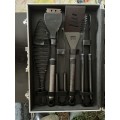 19 piece aluminium braai tools collection in aluminium case, including a black braai apron