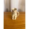Small butter yellow porcelain Toby jug (Lucia Ware)