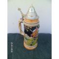 Tall German made steins with pewter lid