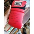 Boxing glove signed by Brian Mitchell. Damaged