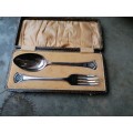 set of Hallmark E.P. N.S fork and spoon, in a snake looking box dated 1931