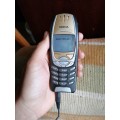 Nokia model 6310i with a original house charger as well and one phone for parts