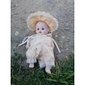 Cute porcelain doll attached by string