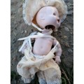 Cute porcelain doll attached by string
