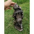 Vintage stone carving of a warrior fighter a tiger