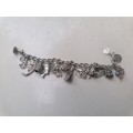 Wow stunning silver charms bracelet with 23 silver charms