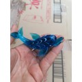 Glass art dolphin. Small chip on top fin