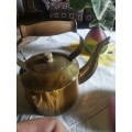 Vintage brass kettle with wood in handle