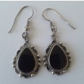 Solid sterling silver teardrop earrings with black stones. Possibly onyx