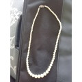 Faux pearls with sterling clasp