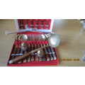 set of 6 knives, folks and spoons in box and 4 skewers,1 large ladle,salt and pepper, as per photo