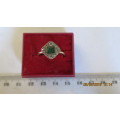 9ct gold, 2,6 gram ring with platinum top, emerald surrounded by diamonds,.......as per photo