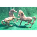 PAIR OF MID CENTURY MODERN SILVER PLATED GALLOPING HORSE FIGURINES