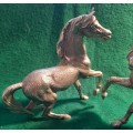 PAIR OF MID CENTURY MODERN SILVER PLATED GALLOPING HORSE FIGURINES