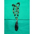 A STUNNING BEADDED NECKLACE WITH A LARGE BLACKSTONE