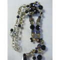 A STUNNING BEADDED NECKLACE WITH A LARGE BLACKSTONE