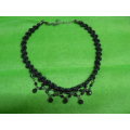 Very pretty material knotted necklace with blackheads