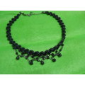 Very pretty material knotted necklace with blackheads