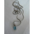 SILVER TONED NECKLACE WITH BLUE STONE