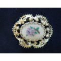GOLD TONED BROOCH WITH FAUX PEARLS AND PETIT POINT FLOWER