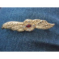 BROOCH WITH RED STONE